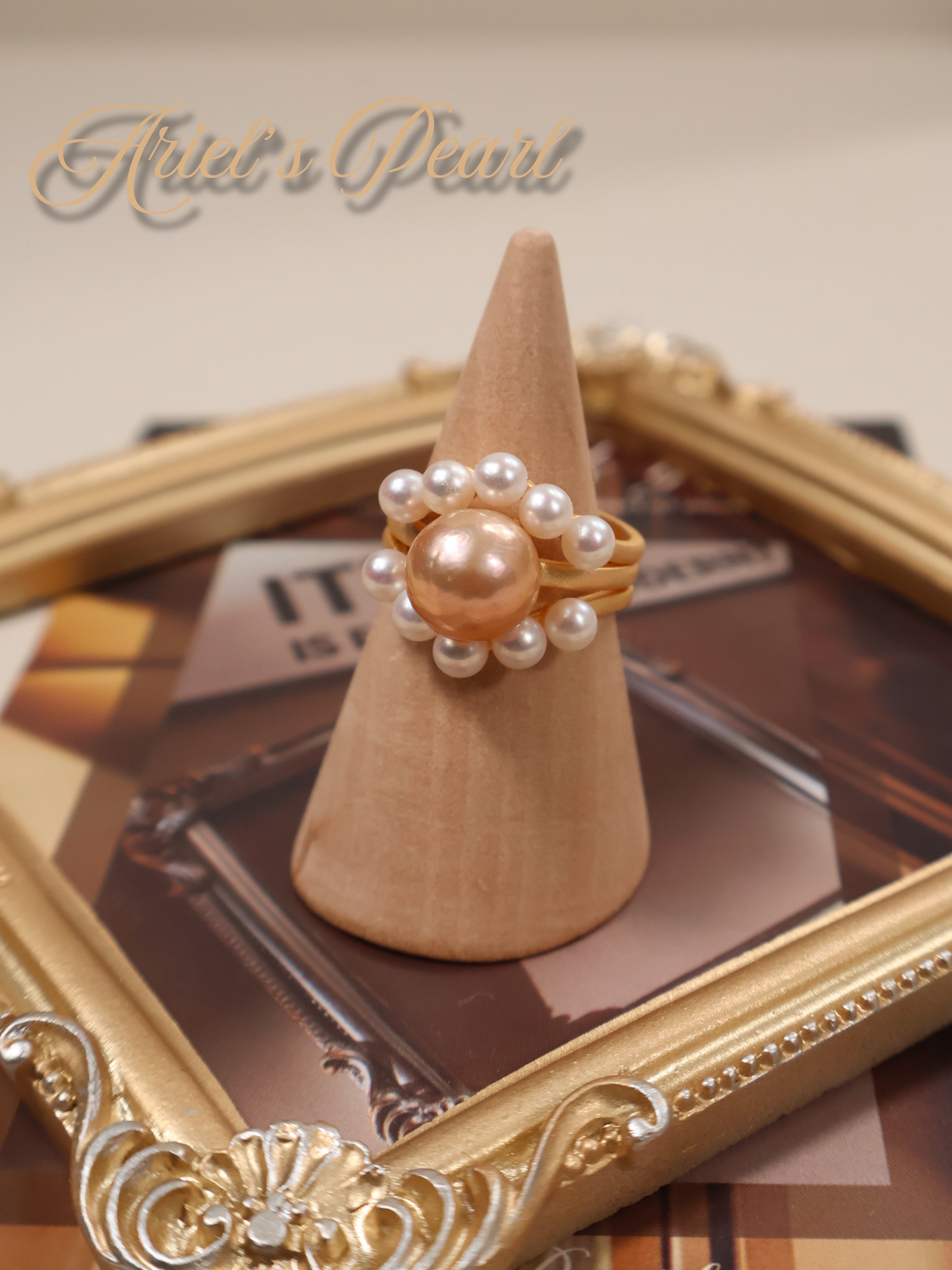 Pearl ring on a wooden cone with a decorative frame in the background